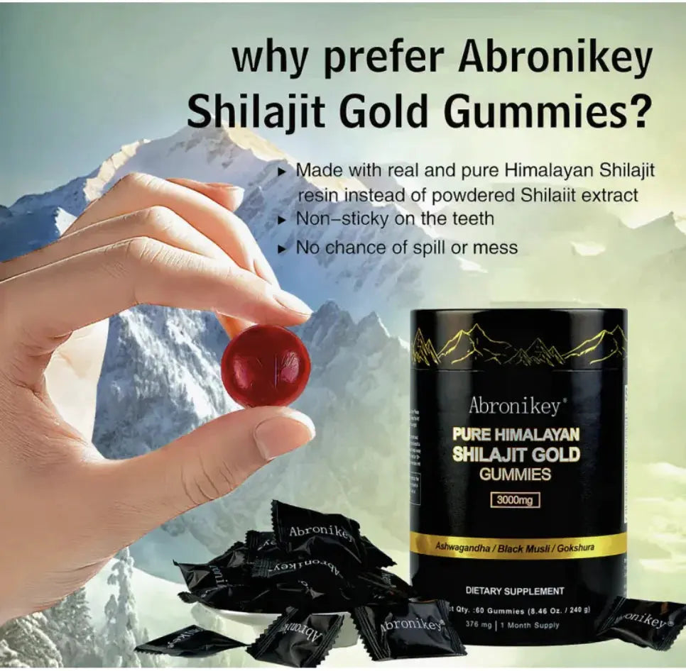 Hand holding a red shilajit gummy with Abronikey Shilajit Gold Gummies container and individual black packets