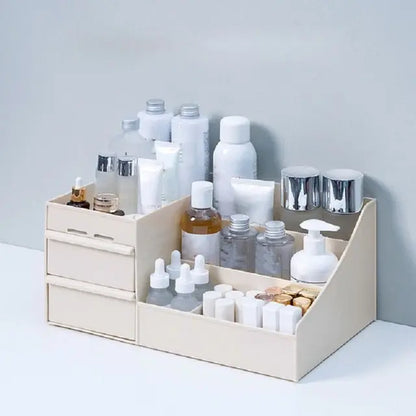 Allebuy beige makeup cosmetics organizer with multiple compartments and drawers for skincare bottles and beauty products