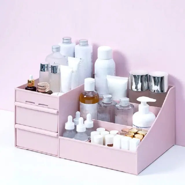 Allebuy pink makeup cosmetics organizer with multiple compartments and drawers holding bottles and tubes