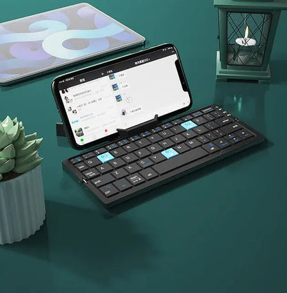 Allebuy compact keyboard with bluetooth in black paired with smartphone on green desk