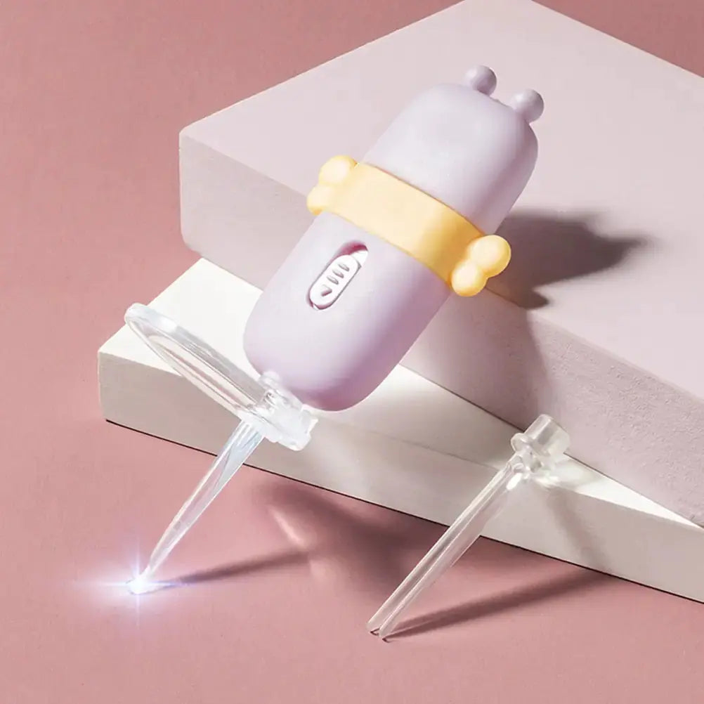 Purple ear candle wax remover with yellow grip and clear disposable tips on pink and white background