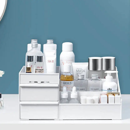 White makeup cosmetics organizer with multiple compartments holding skincare bottles and tubes