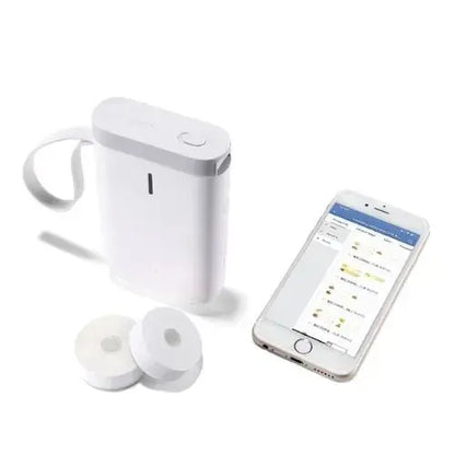 allebuy compact white printer with label printing next to smartphone and extra label rolls