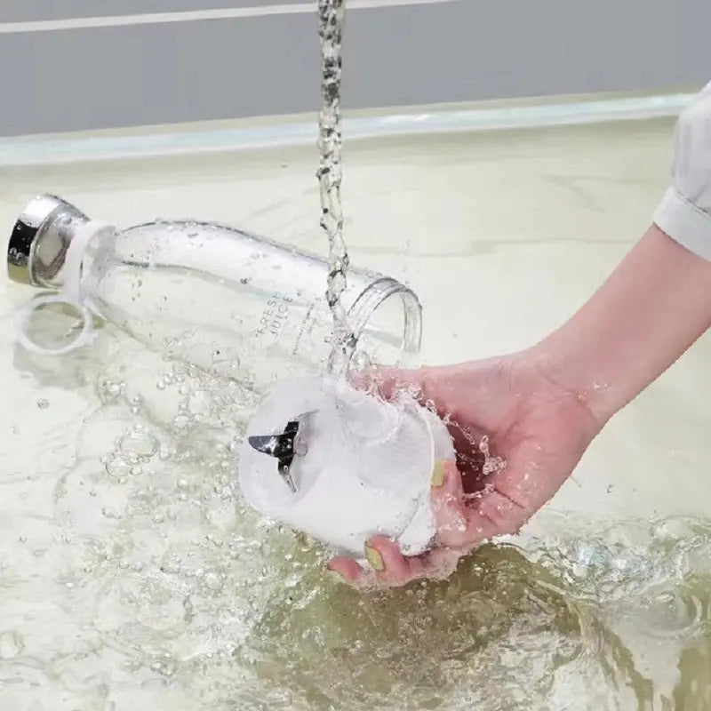 Cleaning ninja blast portable blender detachable blade and bottle under running water