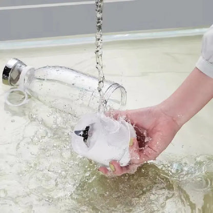 Cleaning ninja blast portable blender detachable blade and bottle under running water