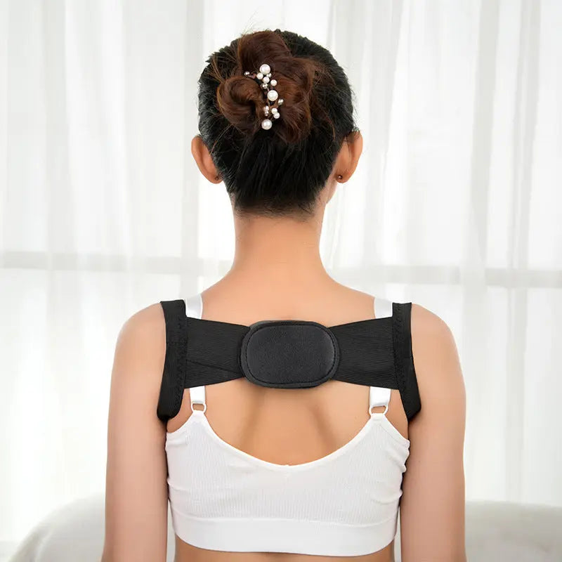 Woman wearing black Allebuy posture corrector over white tank top shown from back