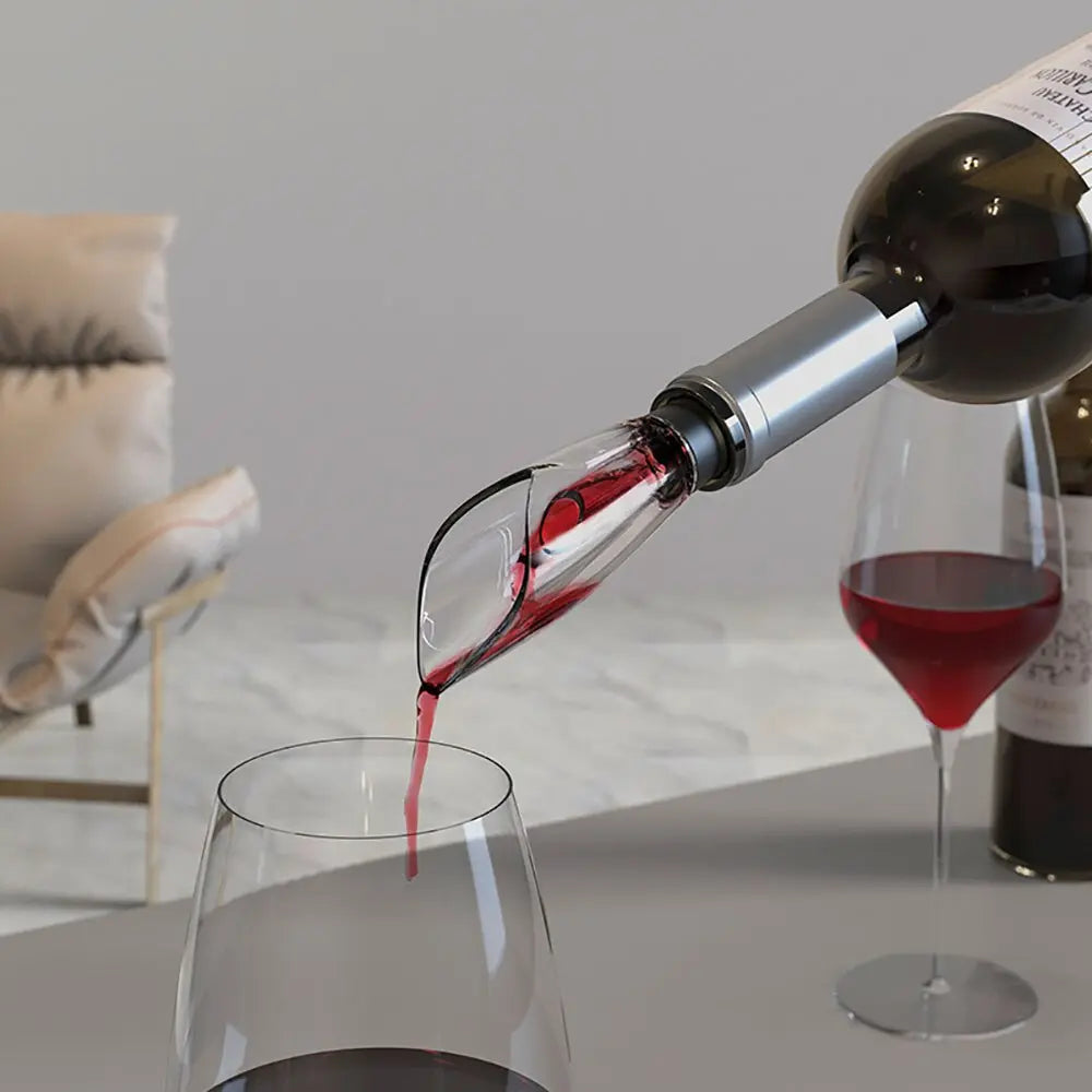 Pouring red wine from a bottle with a silver wine opener showing how to open wine with a bottle opener